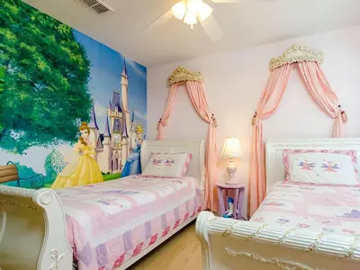 a bedroom with two beds and a disney princess mural at Ev2753 - Golden Horizon Villa in Kissimmee