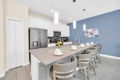 a kitchen with a large island with a counter top at Ev4829 - Lullaby Oasis in Kissimmee
