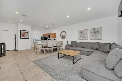 a living room with a couch and a table at Ev30360 - Encantada Villa in Kissimmee