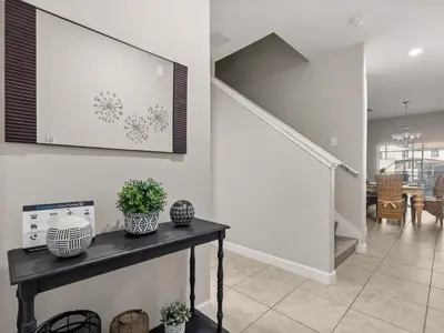 a living room with a table with plants on it at Ev4891 - Harmony Haven Retreat in Kissimmee