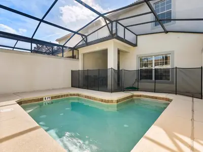 a swimming pool in the middle of a house at Ev4891 - Harmony Haven Retreat in Kissimmee