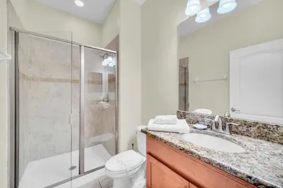 a bathroom with a shower and a toilet and a sink at Ev8940 - Magic Palms Retreat in Kissimmee