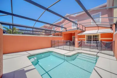 an indoor swimming pool in a house with a glass ceiling at Ev8940 - Magic Palms Retreat in Kissimmee