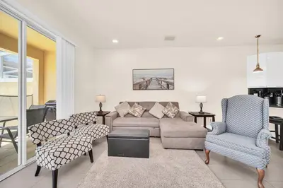 a living room with a couch and chairs at Ev1447 - The Retreat Villa in Orlando