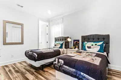 a bedroom with two twin beds and a window at Ev1472 - Reunion Getaway in Orlando