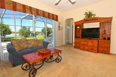 a living room with a couch and a coffee table at Ev1915 - Sunset Glen Villa in Orlando