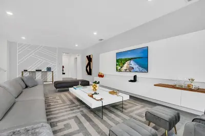a living room with a couch and a table at Ev2395 - Grand Haven Retreat in Kissimmee