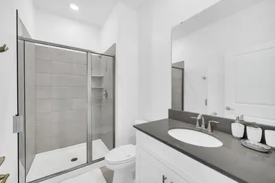 a bathroom with a toilet and a sink and a shower at Ev2444 - Palm Breeze Escape in Kissimmee