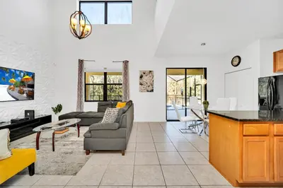 a living room with a couch and a table at Ev2628 - Veranda Palms Hideaway in Kissimmee