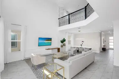 a living room with a couch and a table at Ev2669 - Sunshine Escape Villa in Kissimmee