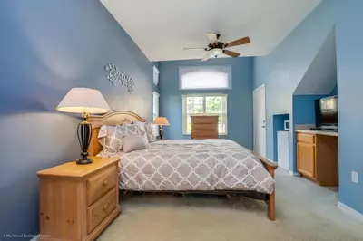 a bedroom with a bed and a ceiling fan at Ev2739 - Emerald Serenity Villa in Kissimmee