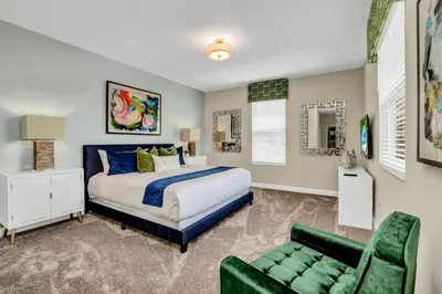 a bedroom with a bed and a couch at Ev2755Book - Golden Horizon Villa in Kissimmee