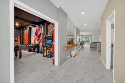 a hallway of a home with a room with a piano at Ev2826 - Magical Horizon Villa in Kissimmee