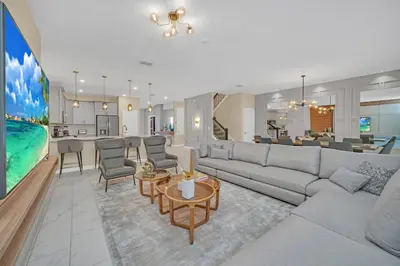 a living room with a couch and a table at Ev2826 - Magical Horizon Villa in Kissimmee