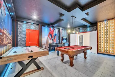 a room with a pool table and a large screen at Ev2826 - Magical Horizon Villa in Kissimmee