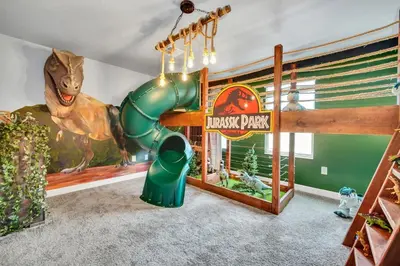 a childs play room with a dinosaur playground at Ev2900 - Sunset Cove Retreat in Kissimmee