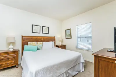 a bedroom with a bed and a window at Ev014 - Lucaya Retreat in Kissimmee