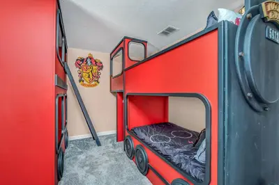 a red train room with a bunk bed in it at Ev2909 - Storey Lake Haven in Kissimmee
