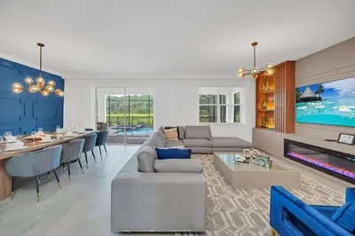 a living room with a couch and a table at Ev2989 - Serenity Palms Villa in Kissimmee