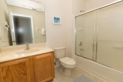 a bathroom with a toilet sink and a shower at Ev3000 - Paradise Hideaway in Orlando