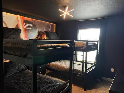 a room with two bunk beds and a window at Ev3007 - Lakeside Escape Villa in Kissimmee