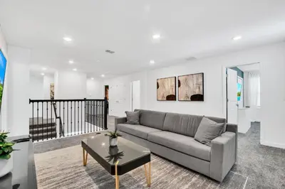 a living room with a couch and a table at Ev3009 - Grand View Retreat in Kissimmee
