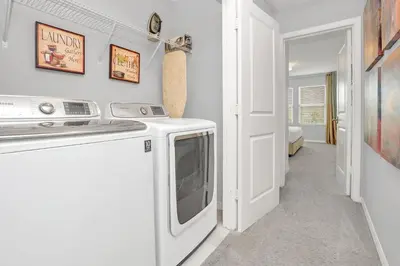a kitchen with a microwave and a dishwasher at Ev3115 - Sunset Bay Villa in Kissimmee