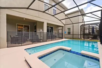 an indoor swimming pool with a large glass ceiling at Ev4152 - Aventure Oasis in Kissimmee