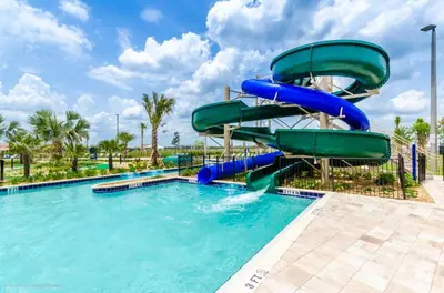 a water slide in a swimming pool at a resort at Ev4152 - Aventure Oasis in Kissimmee