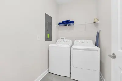 two washing machines in a white laundry room at Ev4569 - Storey Lake Serenity in Kissimmee