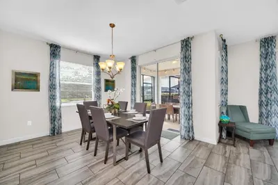 a dining room with a table and chairs at Ev4710 - Regal Villa in Kissimmee