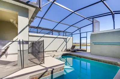 an indoor swimming pool with a glass ceiling at Ev4796 - Palm Bay Retreat in Kissimmee