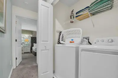 a kitchen with a washing machine in a room at Ev4804 - Starlight Retreat in Kissimmee