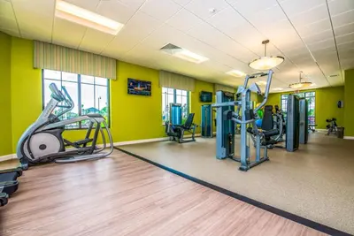 a gym with treadmills and elliptical machines at Ev4815 - Regal Escape Villa in Kissimmee