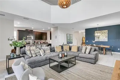 a large living room with a couch and a table at Ev4815 - Regal Escape Villa in Kissimmee