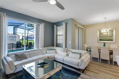 a living room with a couch and a table at Ev4887 - Golden Palms Retreat in Kissimmee