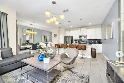 a living room with a couch and a table at Ev4987 - Raceway Retreat in Kissimmee