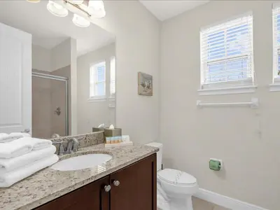 a white bathroom with a sink and a toilet at Ev7501 - Encore in Orlando