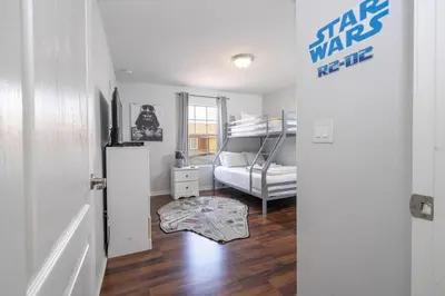 a room with a bedroom with a bed and a door at Ev89270 - Paradise Manor in Kissimmee