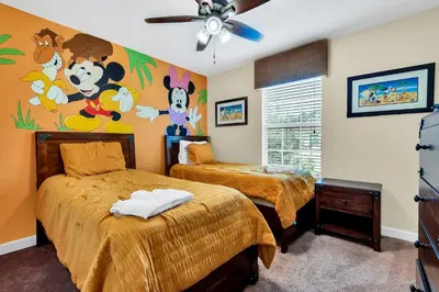 a bedroom with two beds and a ceiling fan at Ev8927 - Paradise Dream Retreat in Kissimmee