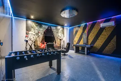a room with a foosball table in the middle at Ev9071- Solara Cove in Orlando
