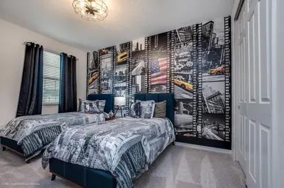 a bedroom with two beds and a wall mural at Ev9071- Solara Cove in Orlando