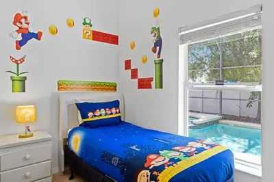 a bedroom with a bed and a swimming pool at Casa 4Q c/ Piscina & Spa no Veranda Palms in Kissimmee