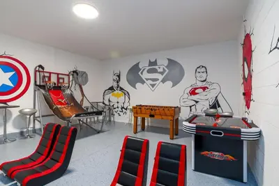 a room with a captain america mural on the wall at BellaVida 8 bed Theme Rooms in Kissimmee