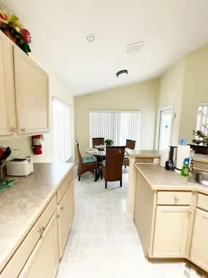 a kitchen with a table and a dining room at Indian Creek 4bd Pool in Orlando