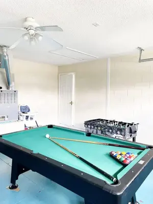 a pool table in a living room with a ceiling at Indian Creek 4bd Pool in Orlando