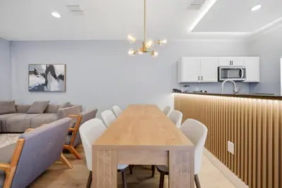 a dining room and kitchen with a table and chairs at NEW Cozy 2 Bedrooms2Baths At Encantada in Kissimmee