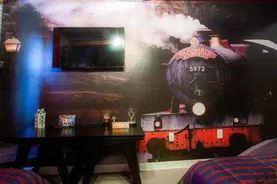 a mural of a steam train on a wall at 8952 Private pool 4bd townhome in Kissimmee
