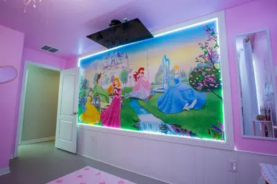 a room with a large painting on the wall at 8952 Private pool 4bd townhome in Kissimmee