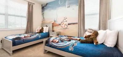a bedroom with two beds with cats laying on them at Ultimate Mansion-9Bed-PoolSpaGame in Orlando